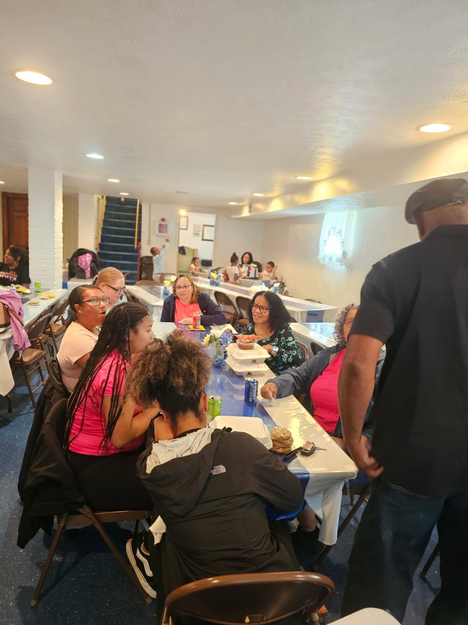 Youth and families gathered at church tables